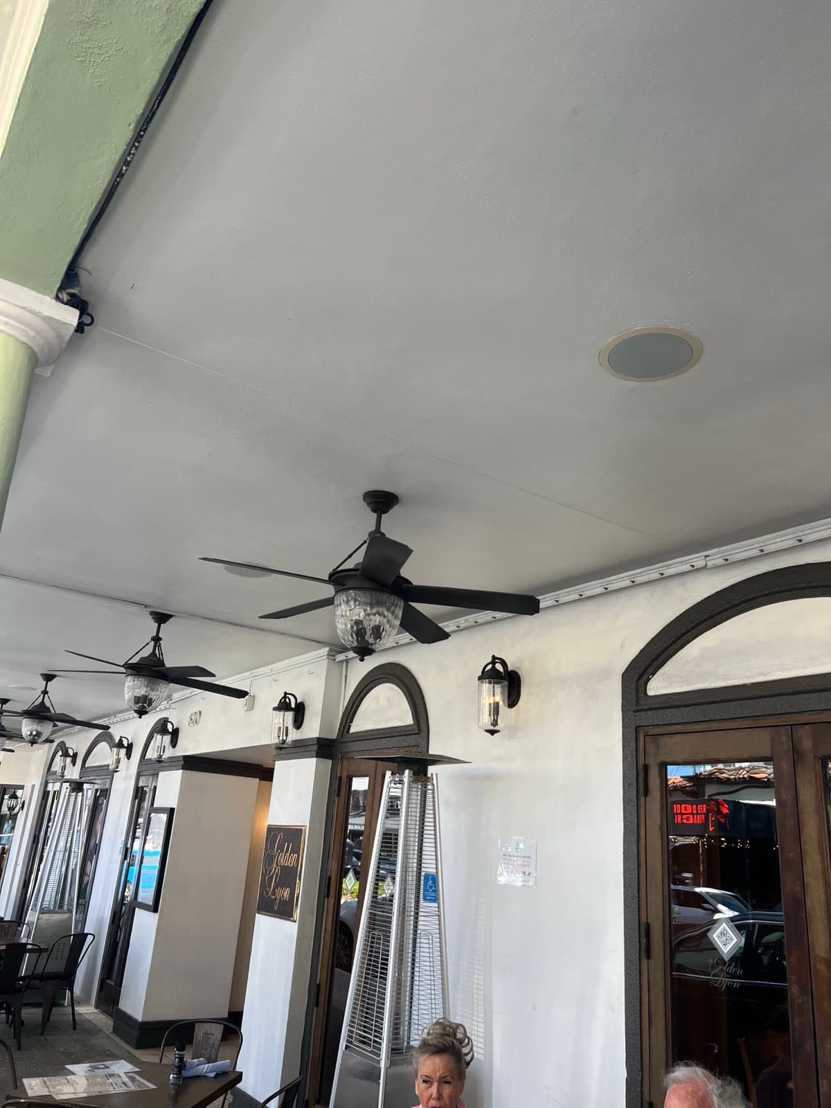Power and signal run along the awning edge with downtown high-rise behind