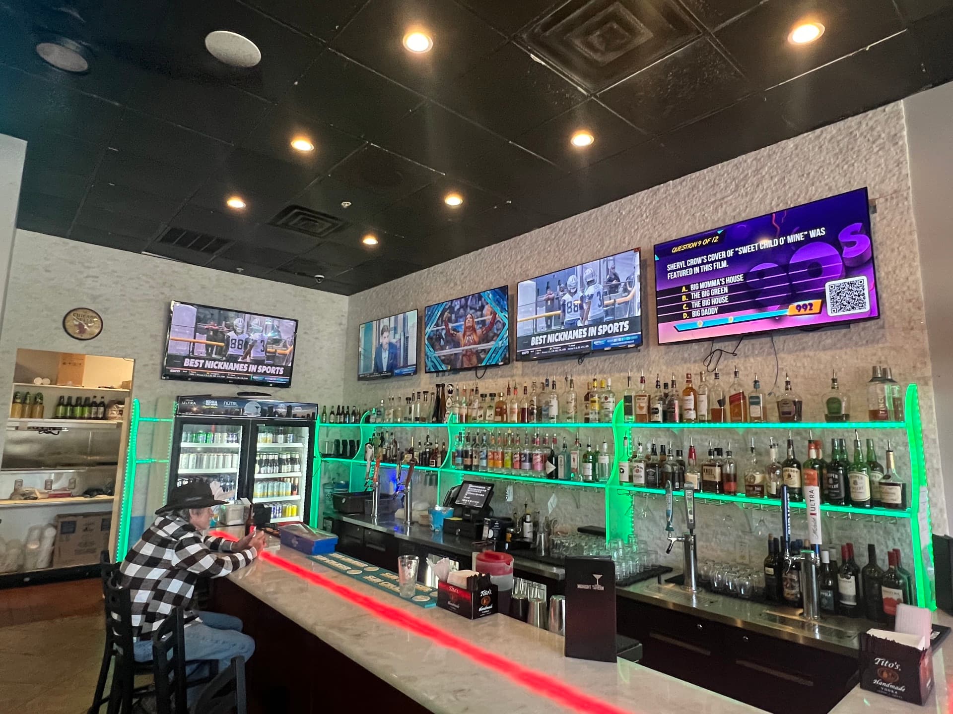 Wide-angle view of outdoor bar with integrated AV