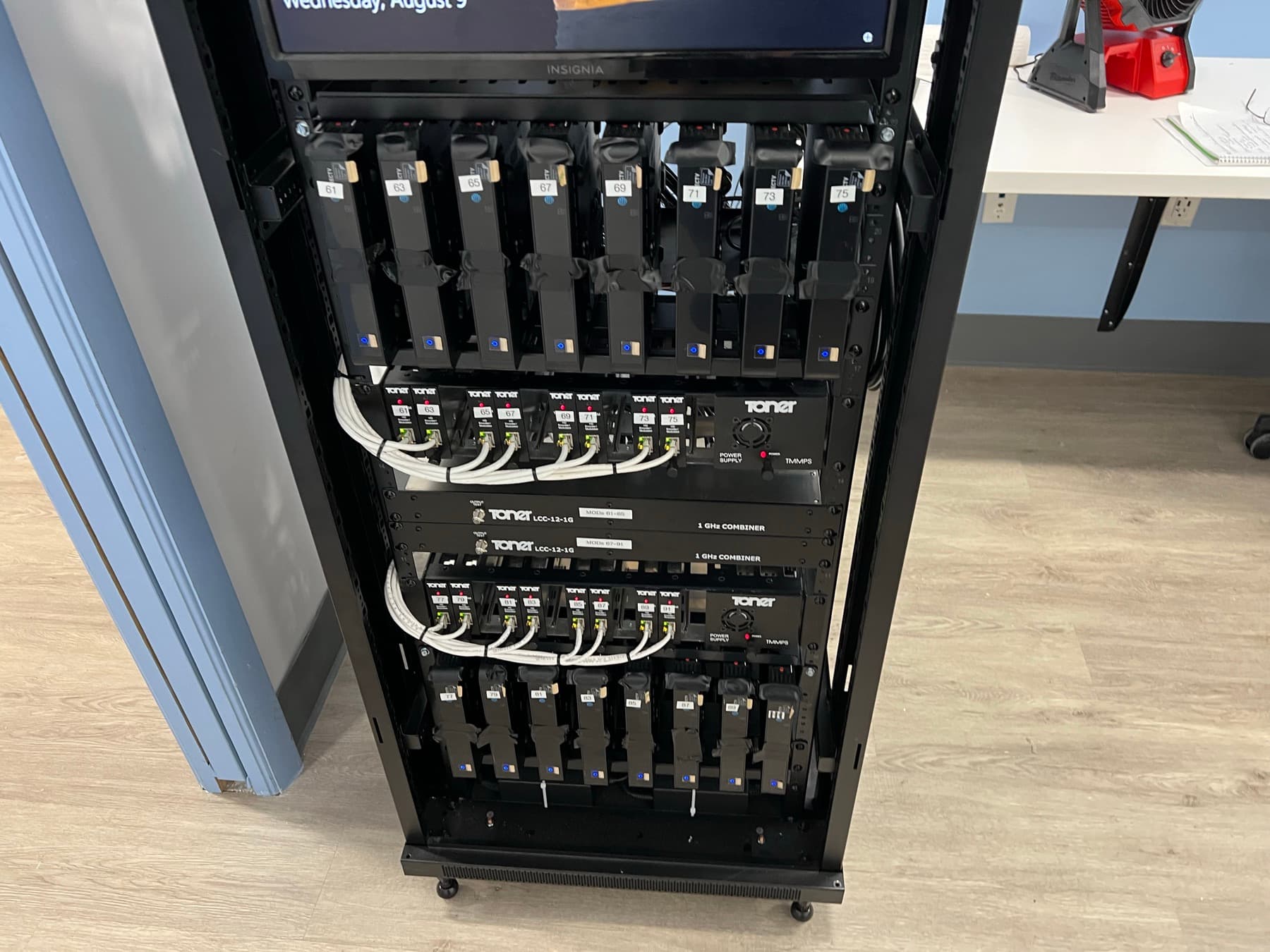 Per-station IR transmitters labeled for each patient TV inside the equipment rack