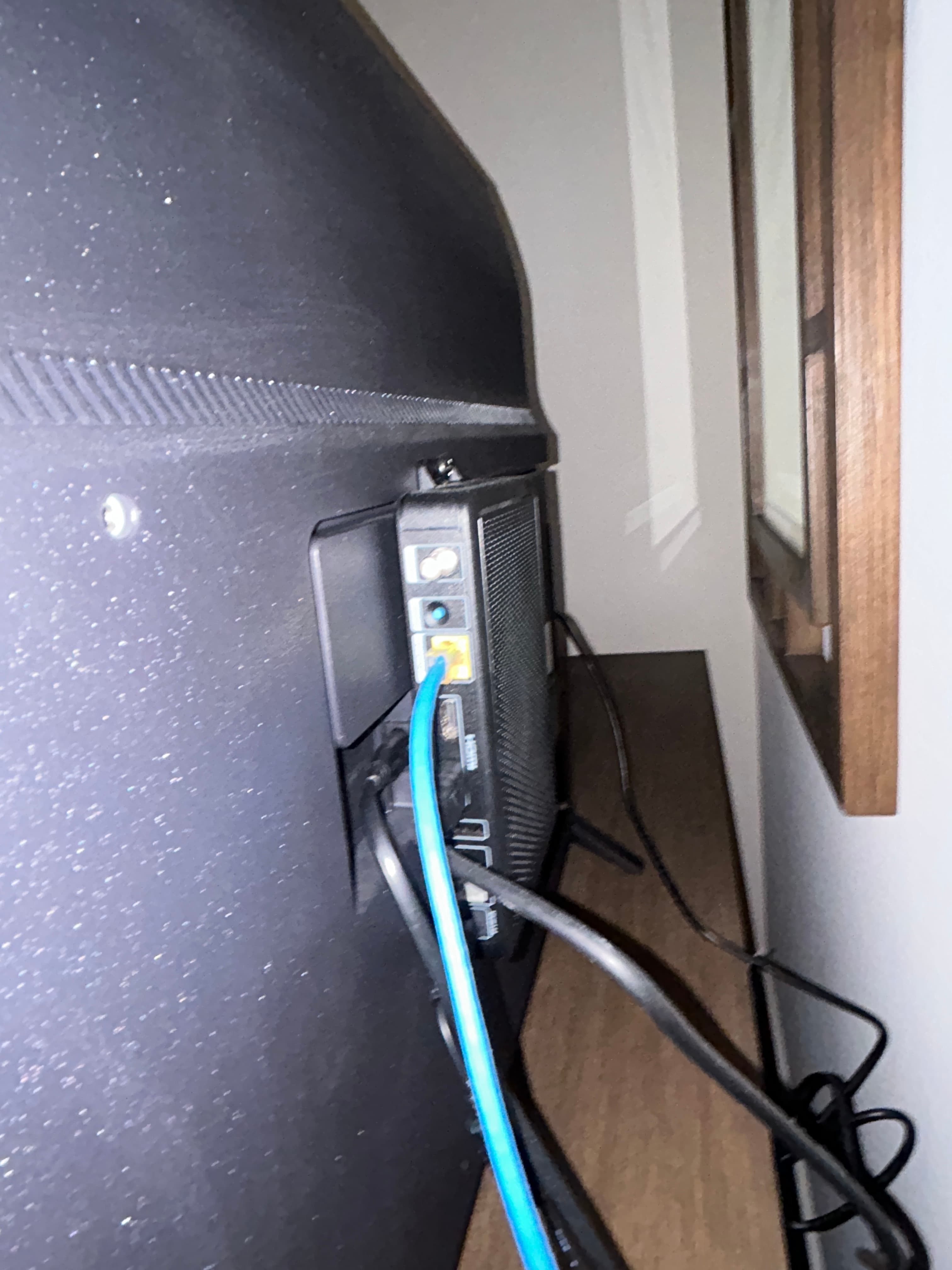 DIRECTV Comm3000 set-top box installed behind the in-room television