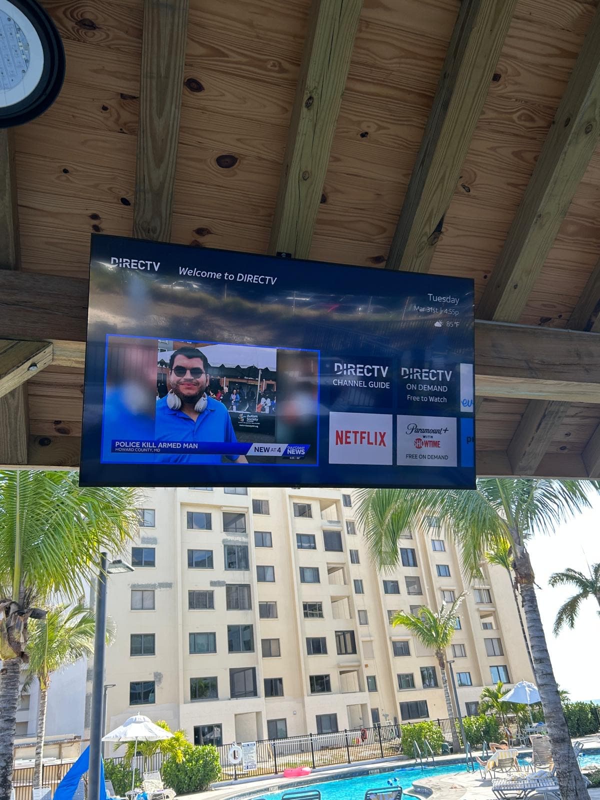 Outdoor pavilion DIRECTV display overlooking the Pointe Estero pool deck