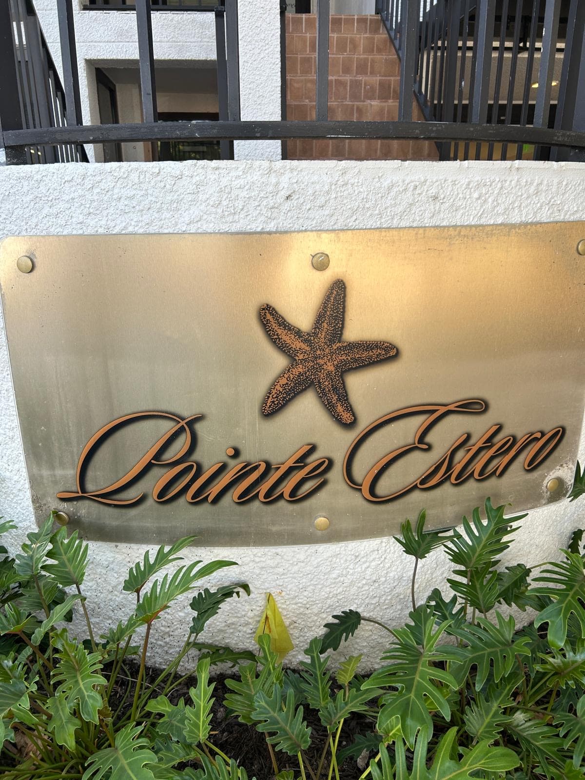 Pointe Estero brass entrance plaque with starfish emblem
