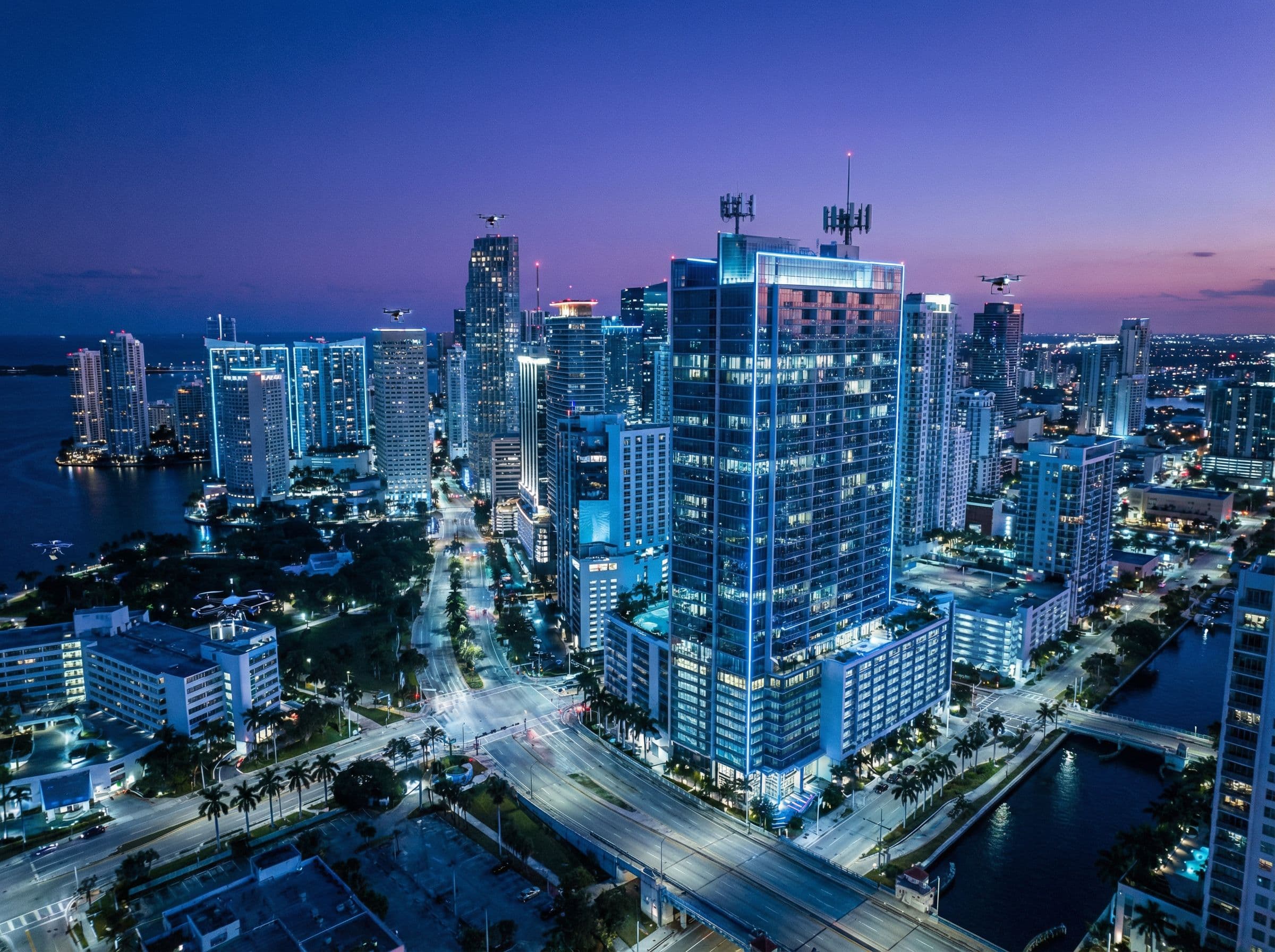 Multi-building property at twilight — multifamily technology integration