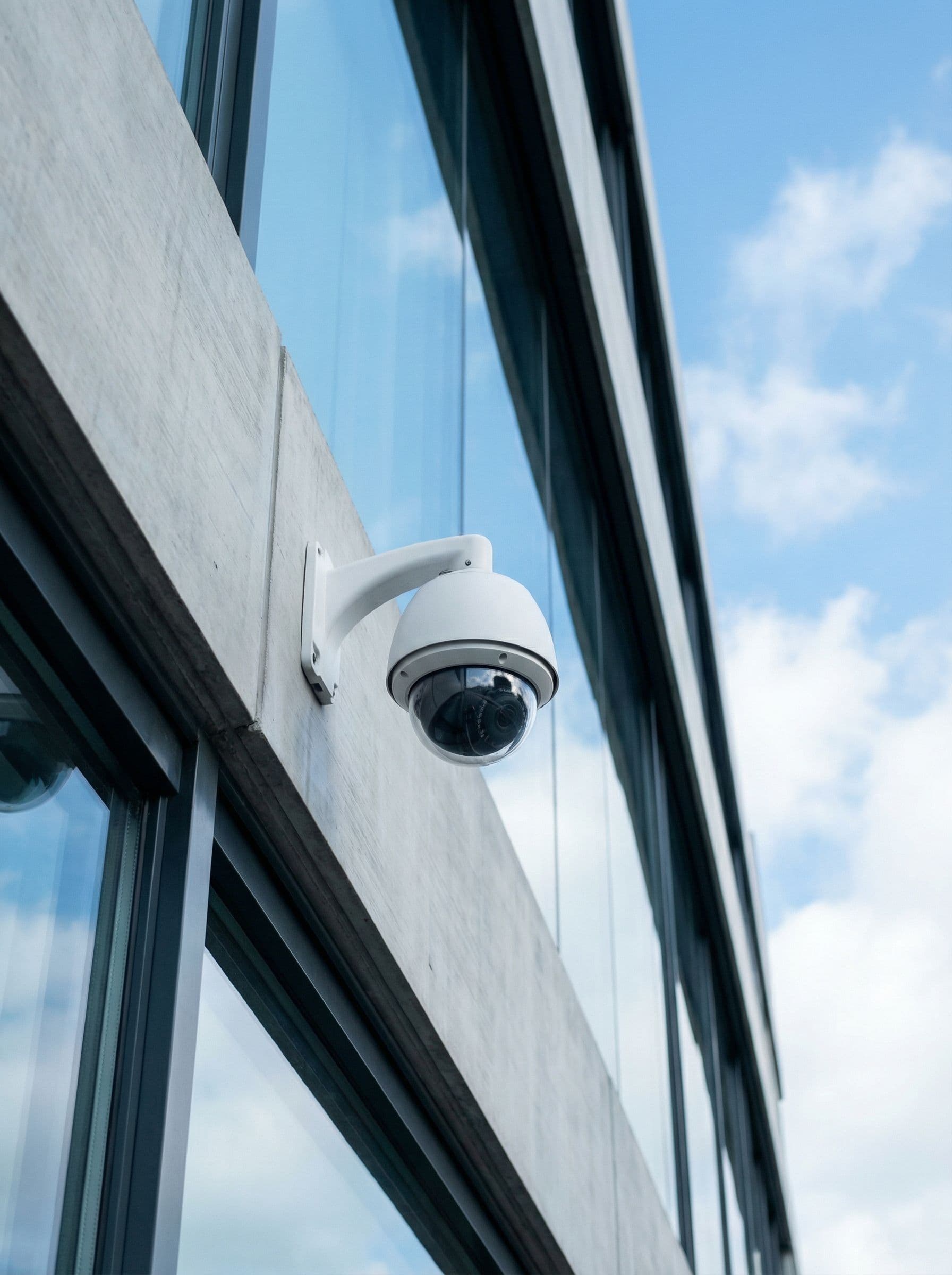 Security operations center with camera feeds and access control panel