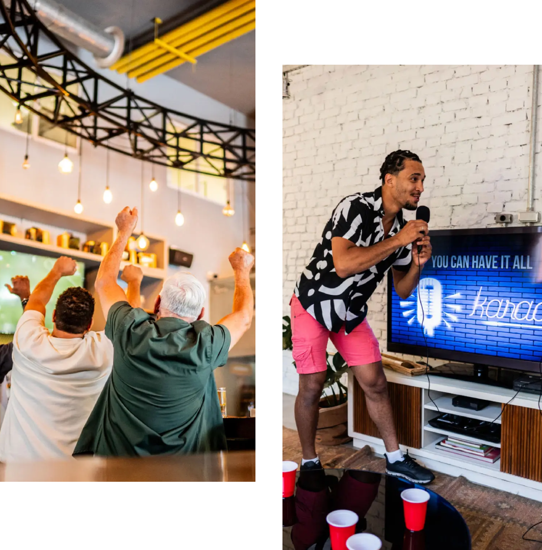Friends enjoying a lively game night with drinks and cheering.