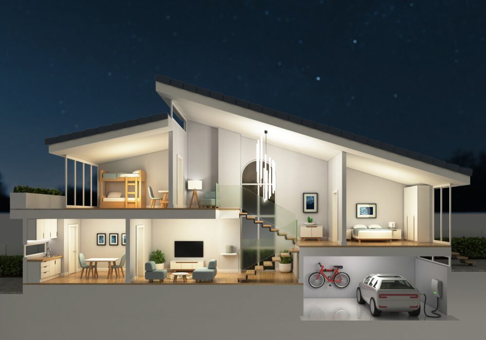 Modern house with large glass windows and a slanted roof at night.